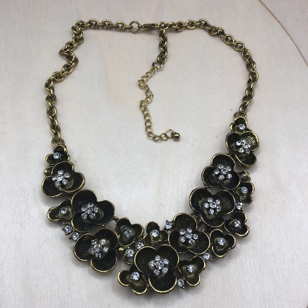 Antiqued brass flower bib necklace-statement style.